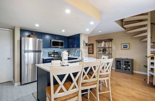 Shelter Cove Villa | Charming bay view villa with pool, washer & dryer, balcony, TV, & full kitchen
