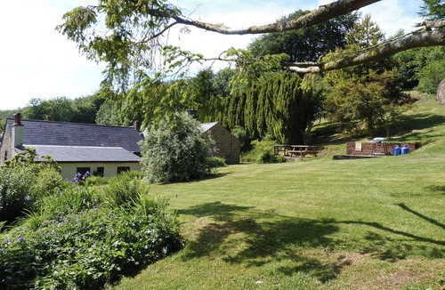 Wheddon Cross Cottage | Nestled in the side of the valley with a indoor heated pool and 5-acre gardens.