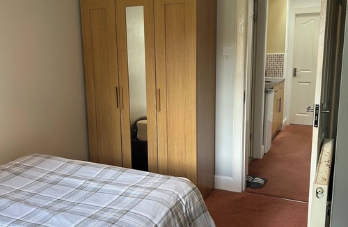 Longcroft House | Peaceful private entrance, 1 minute walk to shops, bus stop; access to 26 bus.