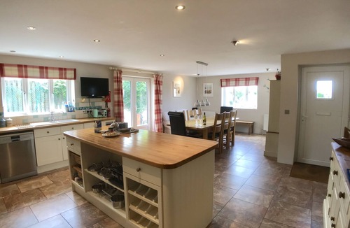 Trevone House | Polcarrek contemporary holiday home with parking and garden. Balcony with rural views
