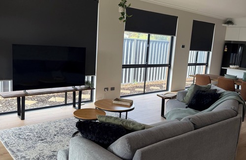 Singleton House | Seaside Escape Kick back and relax in this calm, stylish space.