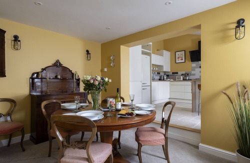 Minchinhampton Cottage | This charming Cotswold stone cottage, elegantly furnished with a seamless blend of antique and conte