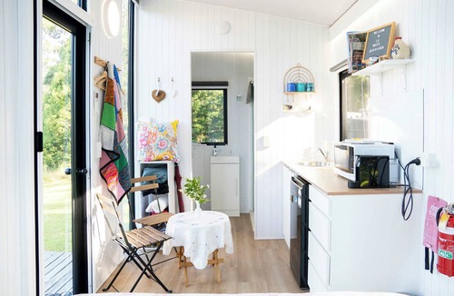 Maleny House | White Jacaranda Tiny House by Tiny Away