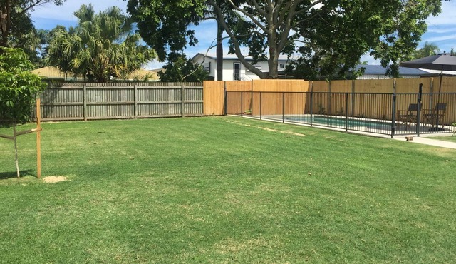 Compact single level home with pool and huge fenced yard