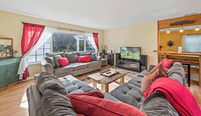 Costa mesa 4 bedroom home with Jacuzzi large yard next to a park.