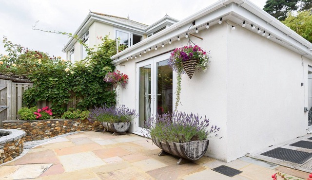 Lovely holiday home with unique and beautifully landscaped paved garden.