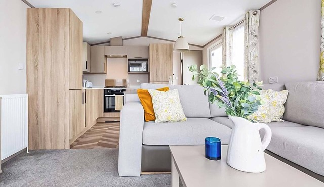 Modern, stylish and spacious 12ft-wide caravan with one double and two twin.